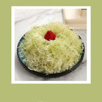 Beige multifunctional slicer chopper with stainless steel blades for shredding and grating vegetables in the kitchen
