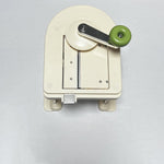 Beige multifunctional slicer chopper with stainless steel blades for shredding and grating vegetables in the kitchen